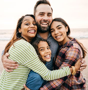 adoptive family at the beach
